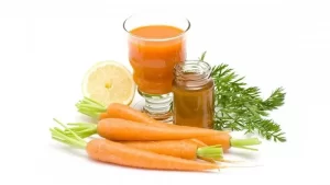 Moist yellow-orange paste with visible lemon zest and carrot mash