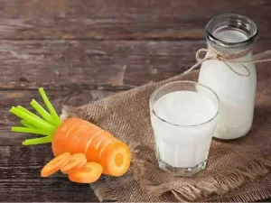 Pale orange mixture of steamed carrot and milk for dry, dull skin
