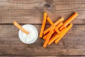 Creamy orange-white mix made from plain yogurt and blended carrots