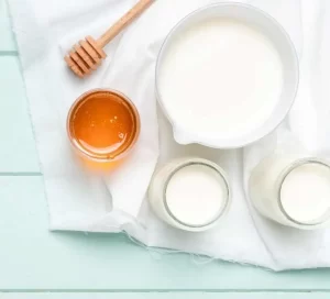 Homemade honey and plain milk face mask for natural skin whitening and hydration.