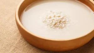 DIY rice water face mask for skin whitening and glowing complexion naturally.