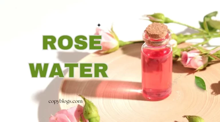 Homemade rose water toner in glass bottle with fresh rose petals on wooden table – natural skincare remedy.