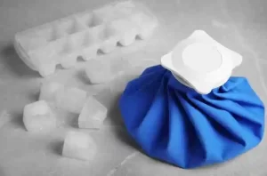 Ice pack wrapped in cloth for swollen gum relief