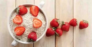 DIY strawberry face mask with oatmeal for gentle exfoliation.