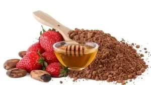 Rich homemade strawberry mask with cocoa powder for glowing skin.