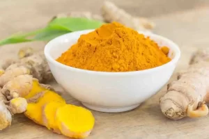 List of turmeric face mask benefits with glowing skin visuals.