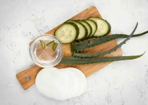 Chilled aloe vera and cucumber mix for sunburned skin relief.
