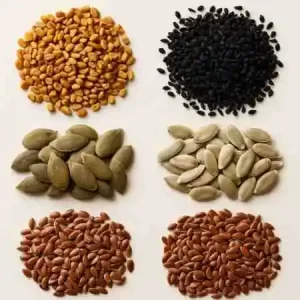 A bowl of five mixed seeds for natural hair growth infusion.