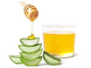 Smooth mixture of honey, gel, and coconut oil in a small ceramic bowl.