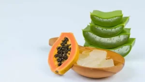 Bright orange papaya mixed with aloe vera gel in a bowl.