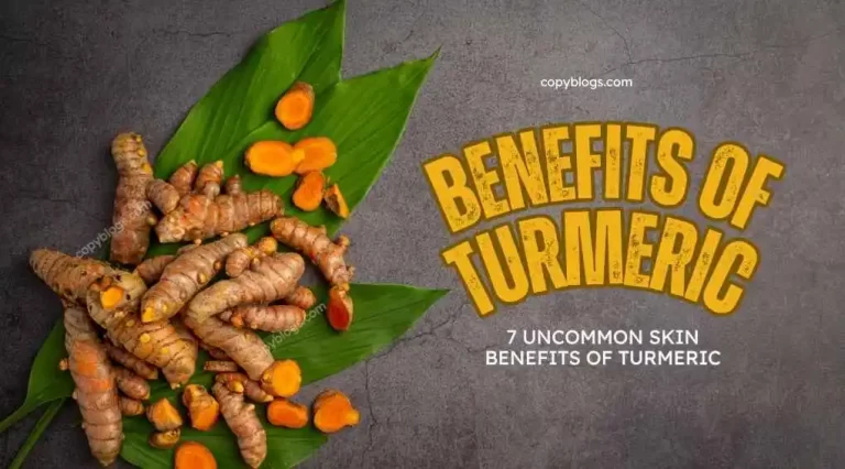 Turmeric skin benefits with raw turmeric roots on green leaves.