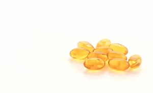 Vitamin E oil capsule used to lighten dark lips.