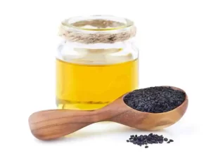 Black seed oil in small glass bottle for natural scar healing and fading.