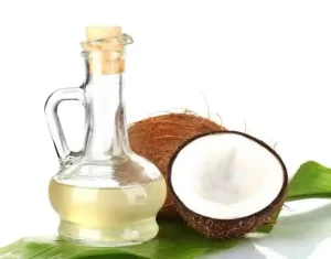 Coconut oil in wooden bowl for scar massage.