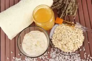 Bowl of oatmeal scrub for gentle skin exfoliation.