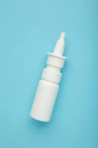 Saline nasal rinse used to flush mucus and improve airflow.