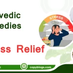 Ayurvedic remedies for stress relief with calming herbs, tea, and essential oils on a wooden table.